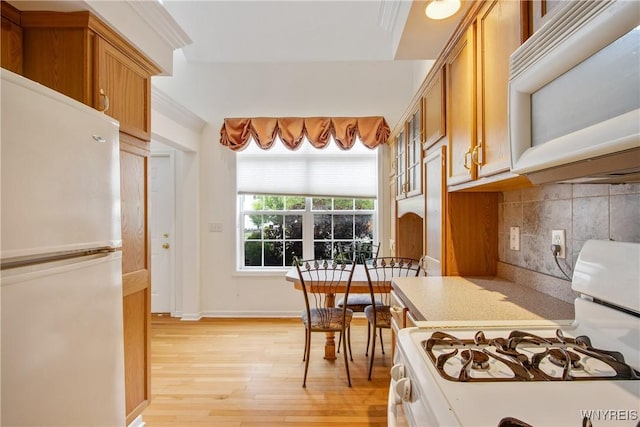 25 Caspian Ct, Amherst, NY 14228 - kitchen with white appliances, light wood-style floors, backsplash, light countertops, and brown cabinets