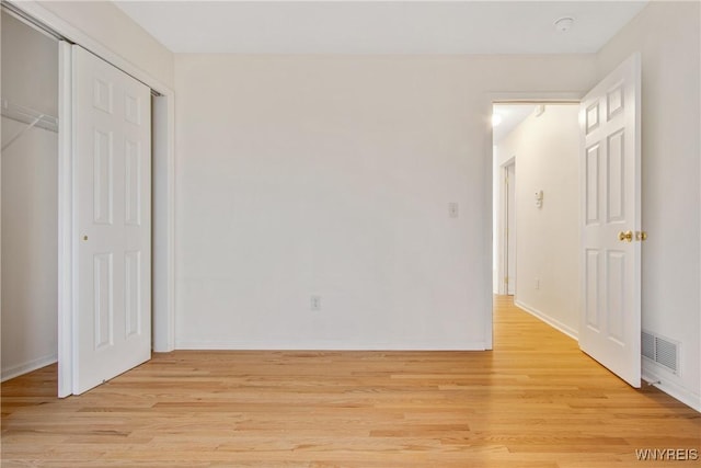 25 Caspian Ct, Amherst, NY 14228 - unfurnished bedroom featuring light wood-type flooring and a closet