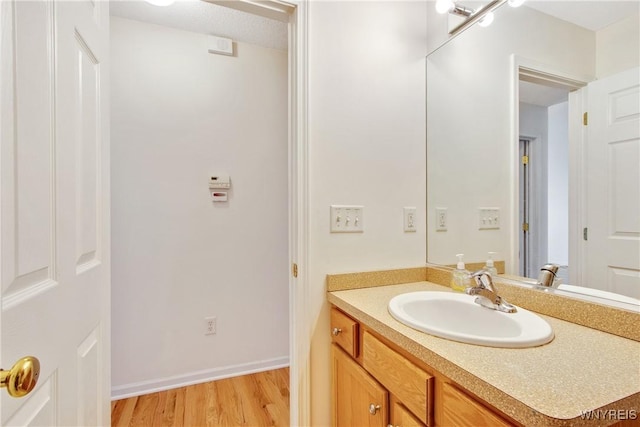 25 Caspian Ct, Amherst, NY 14228 - bathroom with vanity and wood finished floors