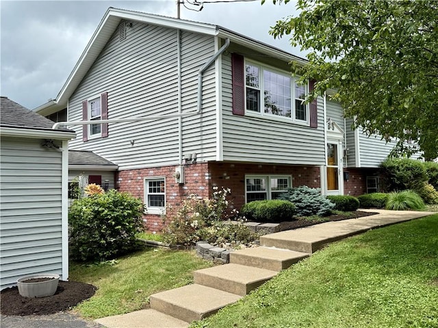 5 Riverside Ave, Oneonta, NY 13820 - view of home's exterior with brick siding and a yard