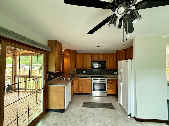 5 Riverside Ave, Oneonta, NY 13820 - kitchen with white appliances, ceiling fan, tasteful backsplash, and brown cabinetry