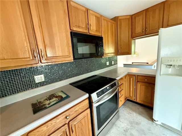 5 Riverside Ave, Oneonta, NY 13820 - kitchen with white fridge with ice dispenser, black microwave, stainless steel range with electric stovetop, tasteful backsplash, and light countertops