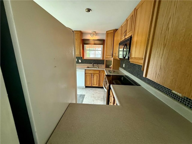5 Riverside Ave, Oneonta, NY 13820 - kitchen with black microwave, stainless steel range with electric cooktop, decorative backsplash, dishwasher, and brown cabinetry