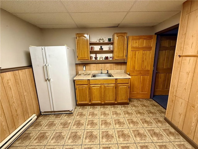 5 Riverside Ave, Oneonta, NY 13820 - kitchen with a baseboard heating unit, freestanding refrigerator, a drop ceiling, light flooring, and brown cabinets
