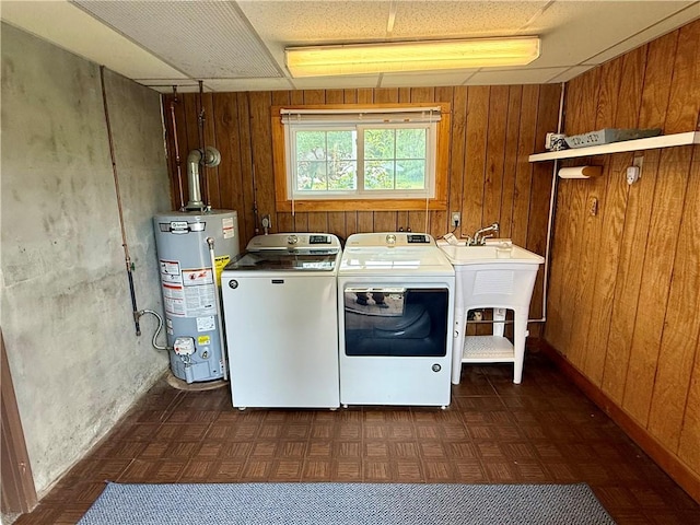 5 Riverside Ave, Oneonta, NY 13820 - laundry room featuring water heater, separate washer and dryer, wood walls, and dark floors