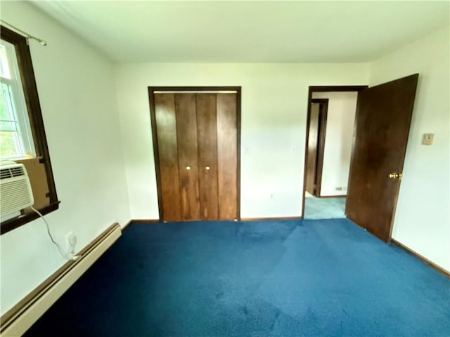 5 Riverside Ave, Oneonta, NY 13820 - unfurnished bedroom featuring a baseboard radiator, a closet, and carpet floors