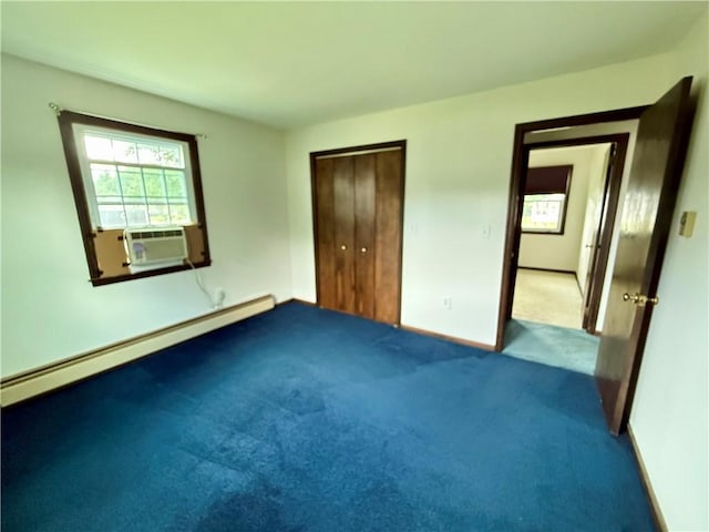 5 Riverside Ave, Oneonta, NY 13820 - unfurnished bedroom featuring a baseboard heating unit, cooling unit, carpet flooring, and a closet