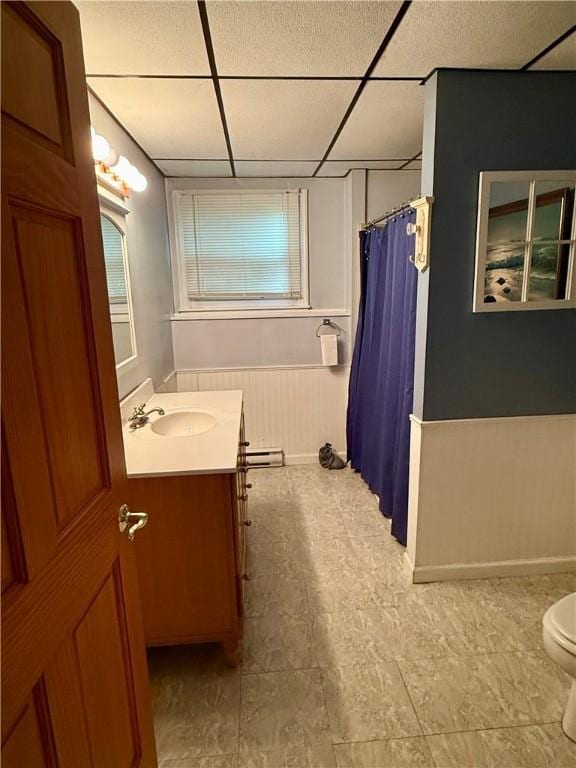 5 Riverside Ave, Oneonta, NY 13820 - bathroom featuring a drop ceiling, vanity, curtained shower, and a baseboard radiator