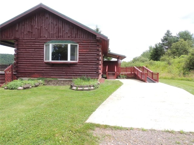 751 County Rd 17, Bainbridge, NY 13733 - view of home's exterior with log siding, a yard, a deck, and a patio area