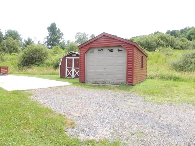 751 County Rd 17, Bainbridge, NY 13733 - detached garage with driveway and a storage shed