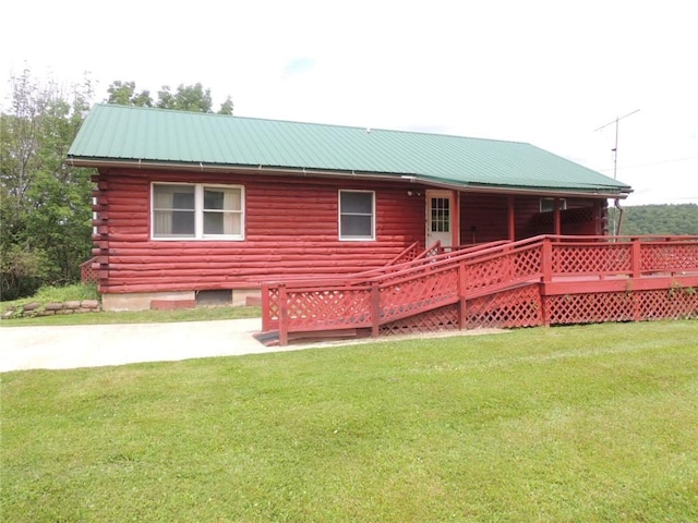 751 County Rd 17, Bainbridge, NY 13733 - back of property featuring a lawn, log exterior, and a metal roof