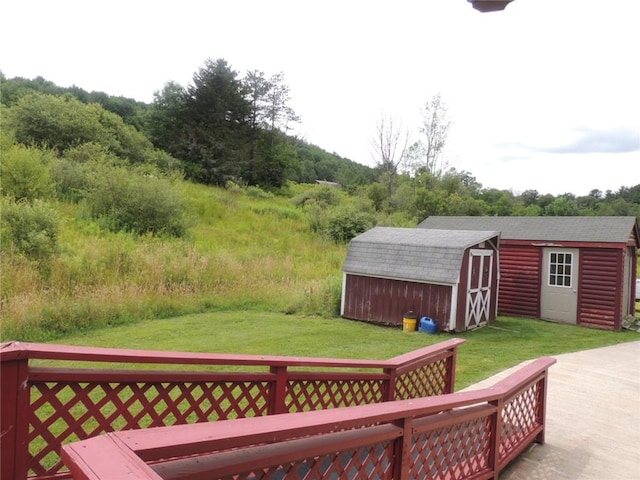 751 County Rd 17, Bainbridge, NY 13733 - view of green lawn featuring a storage unit and a deck