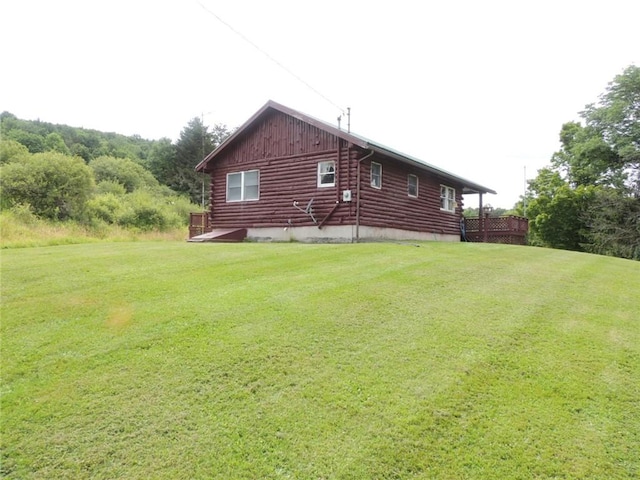 751 County Rd 17, Bainbridge, NY 13733 - view of side of home featuring log exterior, a yard, and board and batten siding