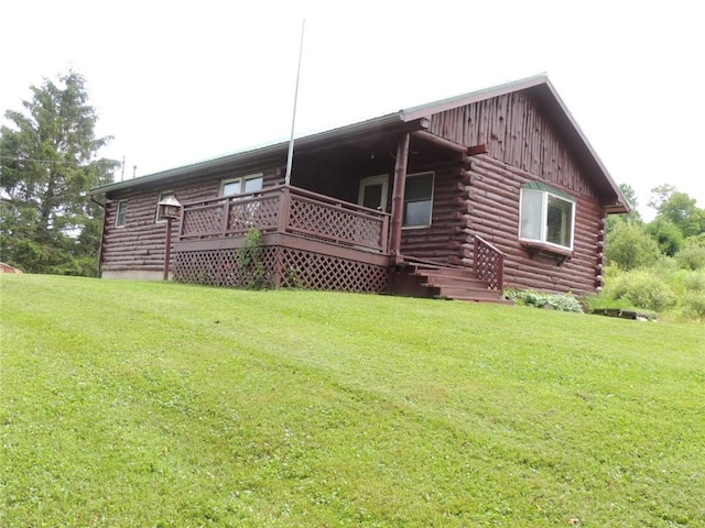 751 County Rd 17, Bainbridge, NY 13733 - rear view of house with log siding and a yard