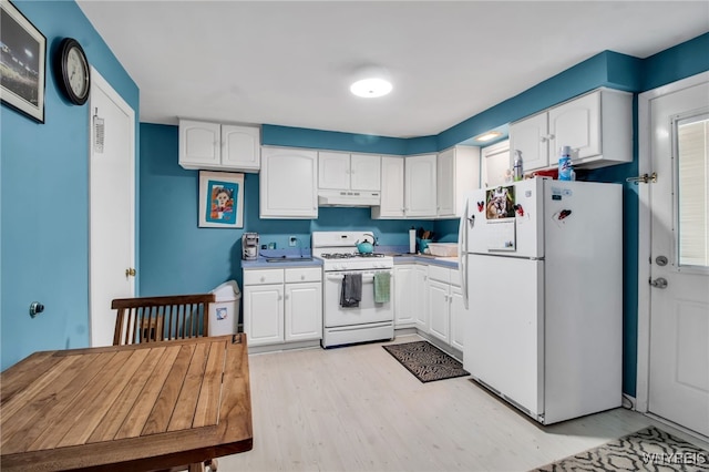 3410 Bullis Rd, Elma, NY 14059 - kitchen with white appliances, under cabinet range hood, white cabinetry, and light wood-style floors