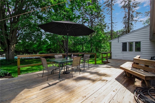 3410 Bullis Rd, Elma, NY 14059 - wooden terrace featuring outdoor dining space and view of wooded area