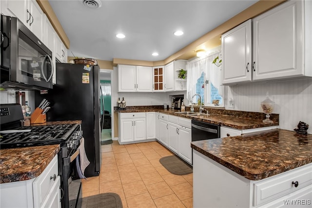 3410 Bullis Rd, Elma, NY 14059 - kitchen featuring black appliances, dark countertops, white cabinets, light tile patterned floors, and recessed lighting
