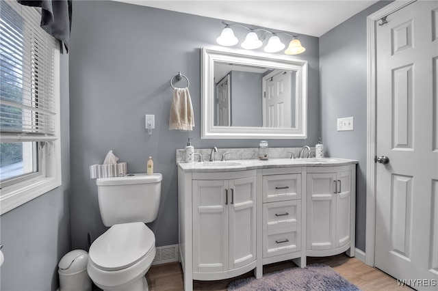 3410 Bullis Rd, Elma, NY 14059 - bathroom with wood finished floors and double vanity