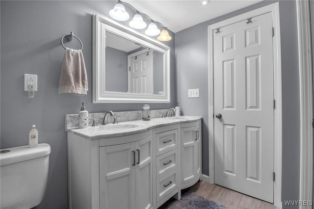 3410 Bullis Rd, Elma, NY 14059 - bathroom with double vanity and wood finished floors