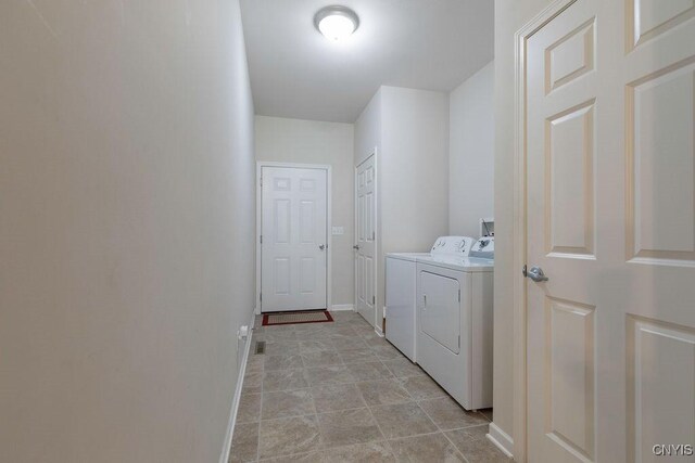8449 Newbury Pl, Clay, NY 13041 - washroom with washing machine and dryer and baseboards