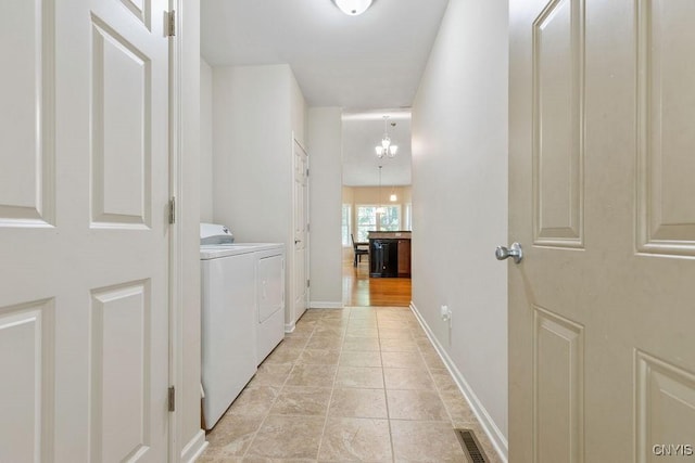 8449 Newbury Pl, Clay, NY 13041 - laundry area with washer and clothes dryer and baseboards