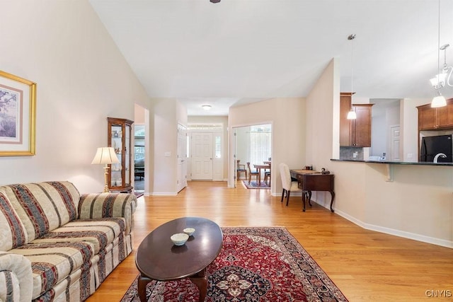 8449 Newbury Pl, Clay, NY 13041 - living area with light wood-style floors and baseboards