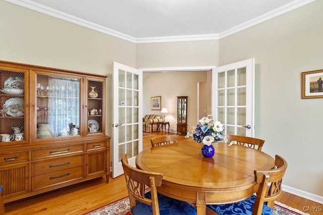 8449 Newbury Pl, Clay, NY 13041 - dining room with ornamental molding, light wood finished floors, and french doors