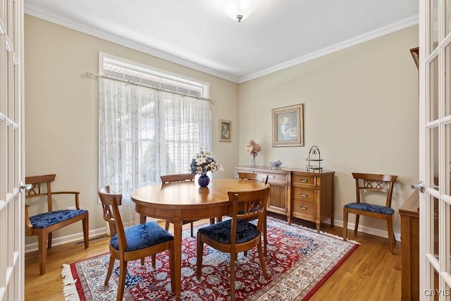 8449 Newbury Pl, Clay, NY 13041 - dining space with light wood finished floors and crown molding