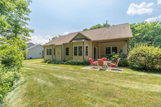 8449 Newbury Pl, Clay, NY 13041 - back of property with a patio area and a yard