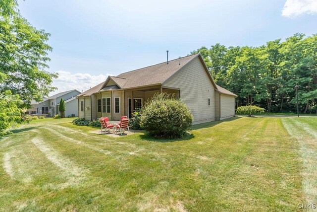 8449 Newbury Pl, Clay, NY 13041 - back of house featuring a yard