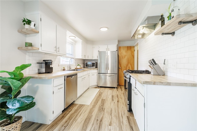 118 Fern Castle Dr, Irondequoit, NY 14622 - kitchen with stainless steel appliances, open shelves, tasteful backsplash, and light wood-style flooring