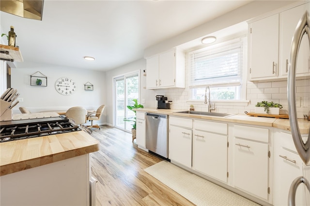 118 Fern Castle Dr, Irondequoit, NY 14622 - kitchen with dishwasher, light wood finished floors, backsplash, white cabinets, and wood counters