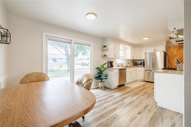 118 Fern Castle Dr, Irondequoit, NY 14622 - dining room with light wood-style floors