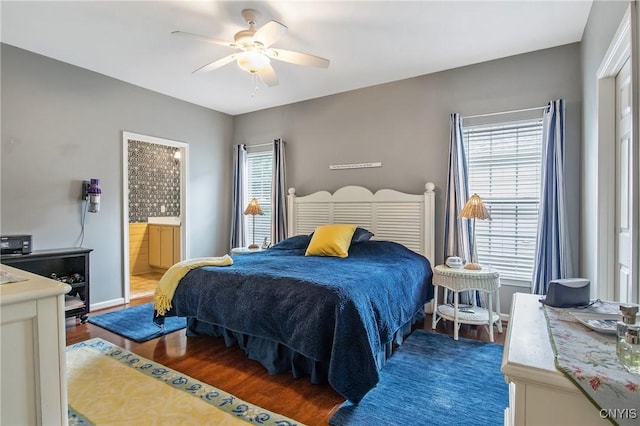 115 Shire Way, Camillus, NY 13031 - bedroom featuring wood finished floors, connected bathroom, and a ceiling fan