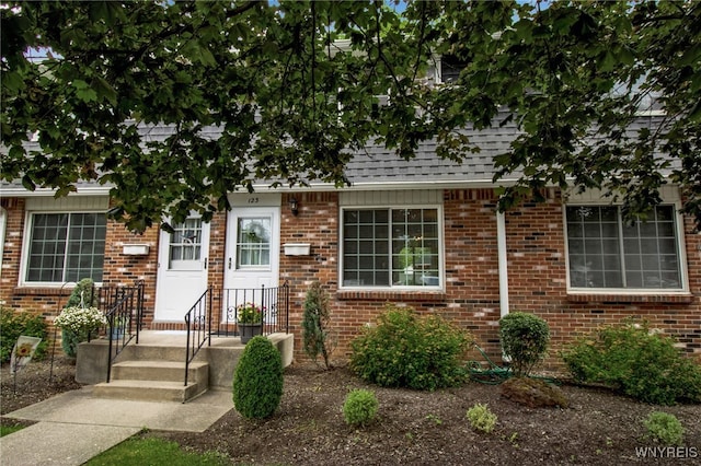 150 S Union Rd Unit 123, Amherst, NY 14221 - view of front facade with roof with shingles and brick siding
