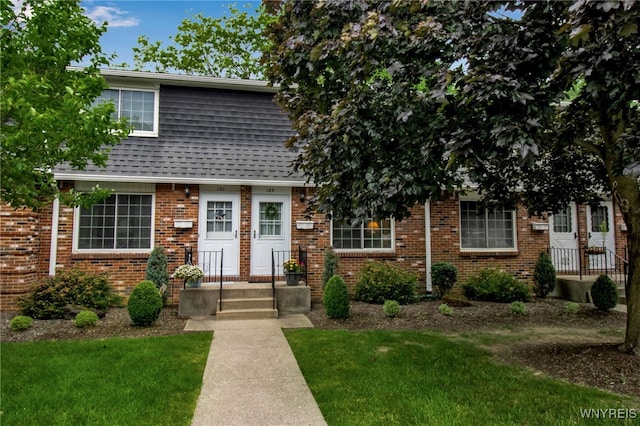 150 S Union Rd Unit 123, Amherst, NY 14221 - view of property featuring a front lawn, brick siding, and a shingled roof