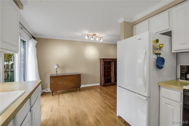150 S Union Rd Unit 123, Amherst, NY 14221 - kitchen featuring freestanding refrigerator, ornamental molding, light countertops, light wood-style flooring, and white cabinetry
