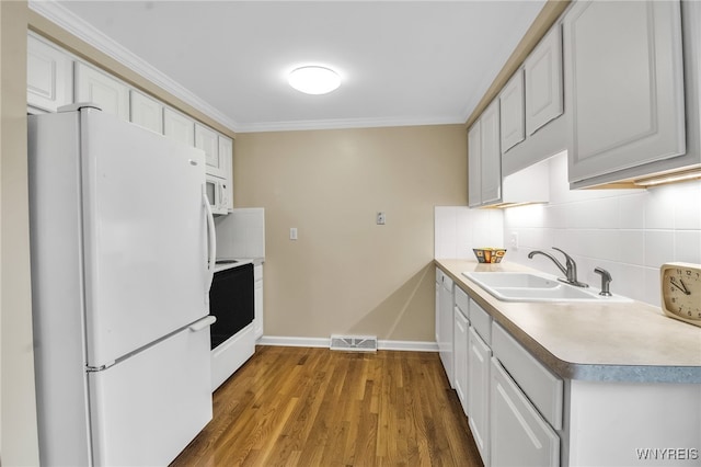150 S Union Rd Unit 123, Amherst, NY 14221 - kitchen with white appliances, tasteful backsplash, ornamental molding, wood finished floors, and white cabinets