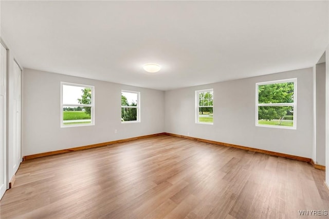 10655 Millers Rd, Yates, NY 14098 - unfurnished room featuring plenty of natural light and light wood finished floors
