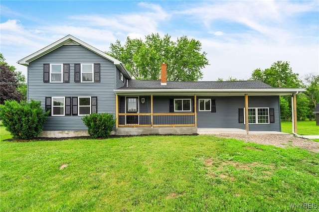 10655 Millers Rd, Yates, NY 14098 - rear view of house with a chimney and a lawn