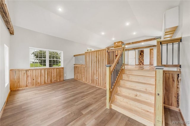 10655 Millers Rd, Yates, NY 14098 - stairs with wood finished floors, vaulted ceiling, and recessed lighting
