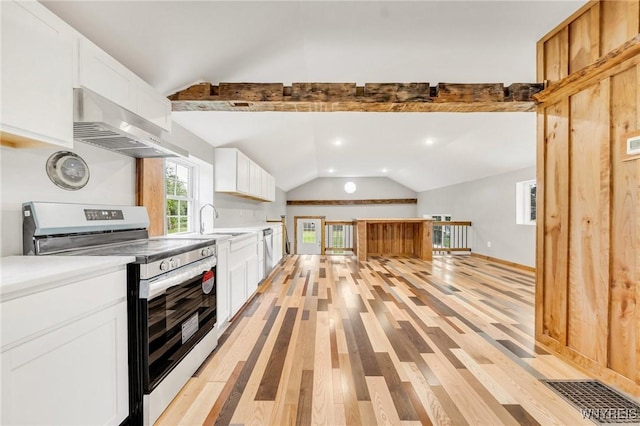 10655 Millers Rd, Yates, NY 14098 - kitchen featuring stainless steel appliances, extractor fan, vaulted ceiling, light wood-style floors, and light countertops