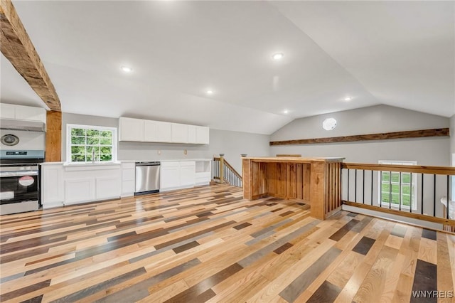 10655 Millers Rd, Yates, NY 14098 - kitchen featuring appliances with stainless steel finishes, light wood-type flooring, white cabinets, light countertops, and lofted ceiling