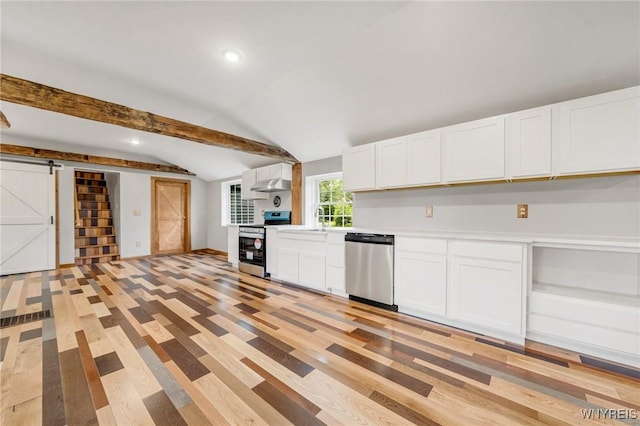 10655 Millers Rd, Yates, NY 14098 - kitchen featuring appliances with stainless steel finishes, a barn door, white cabinetry, light countertops, and light wood finished floors