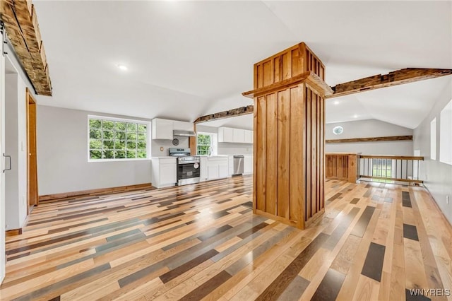 10655 Millers Rd, Yates, NY 14098 - unfurnished living room with vaulted ceiling, light wood-type flooring, and recessed lighting