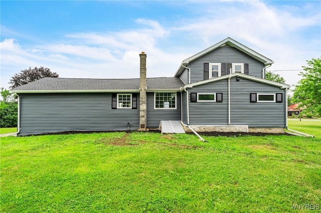 10655 Millers Rd, Yates, NY 14098 - back of property featuring a lawn and a chimney