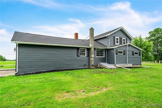 10655 Millers Rd, Yates, NY 14098 - back of property featuring a chimney and a yard