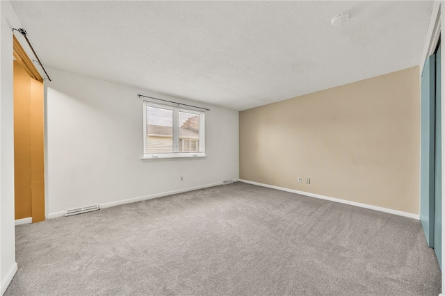 35 Stoneledge, Amherst, NY 14221 - empty room featuring carpet flooring and a textured ceiling