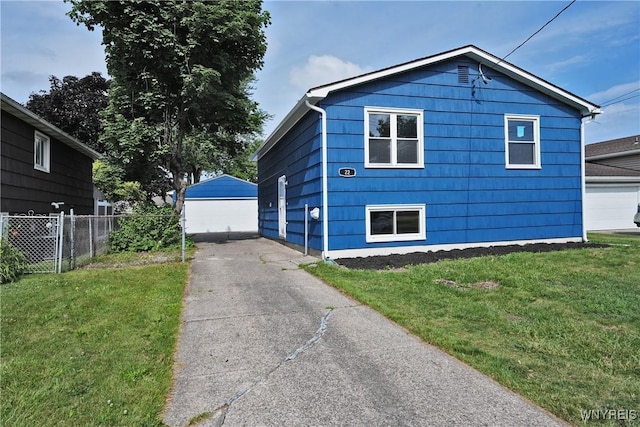 22 Vanderbilt Ave, Cheektowaga, NY 14043 - view of home's exterior featuring a detached garage and an outdoor structure