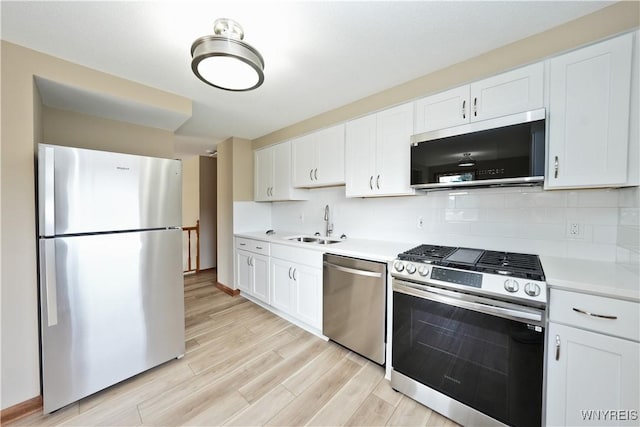 22 Vanderbilt Ave, Cheektowaga, NY 14043 - kitchen with stainless steel appliances, light countertops, light wood finished floors, and white cabinets
